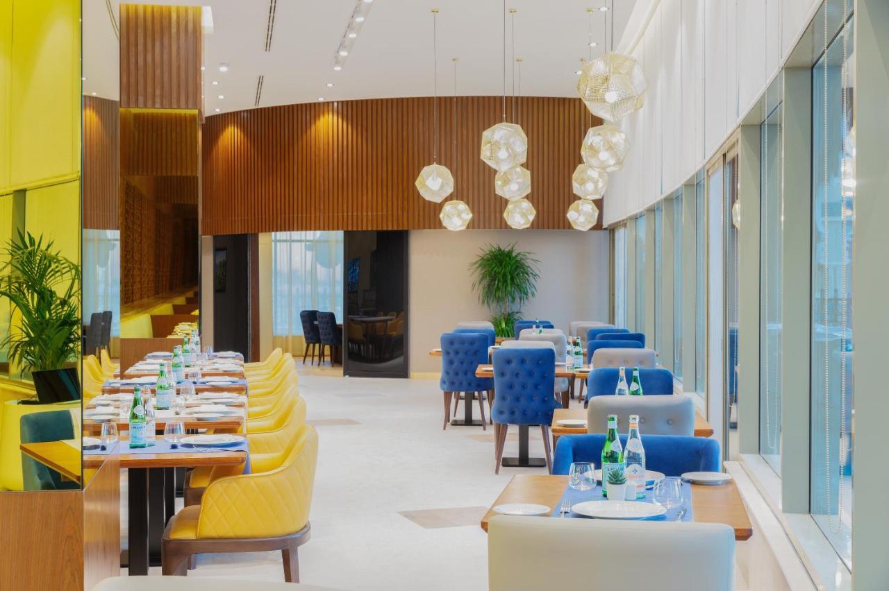 ออคซิเดนทัล อัลจัดดาฟ Hotel ดูไบ ภายนอก รูปภาพ Interior of the restaurant